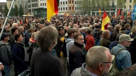 Thousands protest in east Germany against anti-migrant group