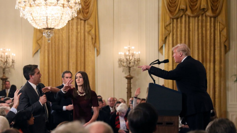 US President Donald Trump points to journalist Jim Acosta (centre) from CNN during a press conference in Washington, November 7,AFP