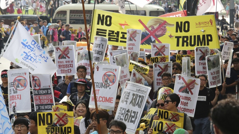 Iranpress: South Korea welcomes Trump with massive protests 