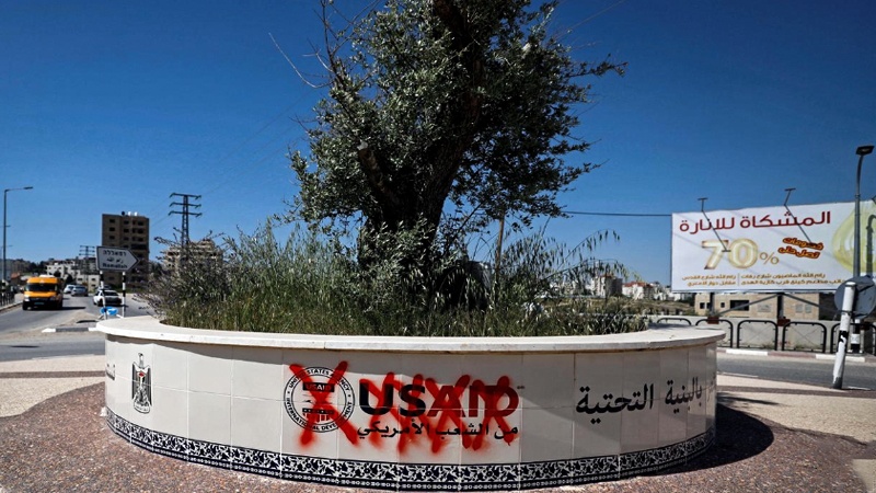 A crossed out logo of the US Agency for International Development (USAID) is seen in Ramallah, in the Israeli-occupied West Bank May 14, 2019. REUTERS