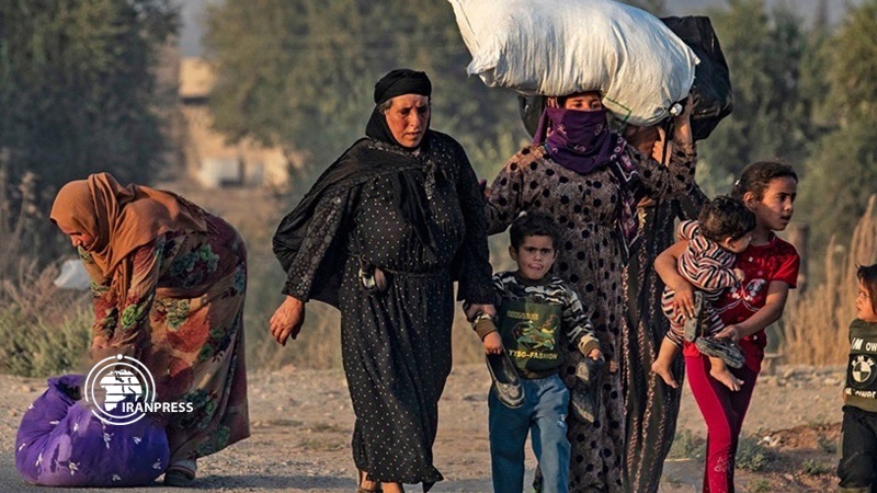 Iranpress: More than 60,000 people displaced, following Turkish invasion to Syria