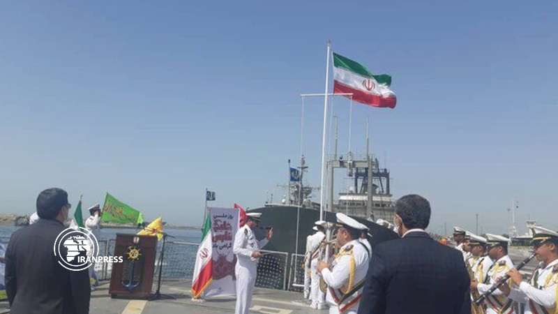 Iranpress: On National Day of Persian Gulf, Iranian flag hoisting over Jamaran Destroyer
