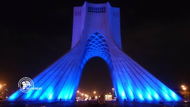 Iranpress: Azadi Tower illuminated in blue to mark World Autism Awareness Day