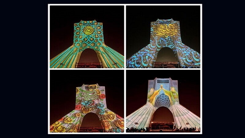Iranpress: برج آزادي يضيء بألوان متنوعة بمناسبة عيد الغدير