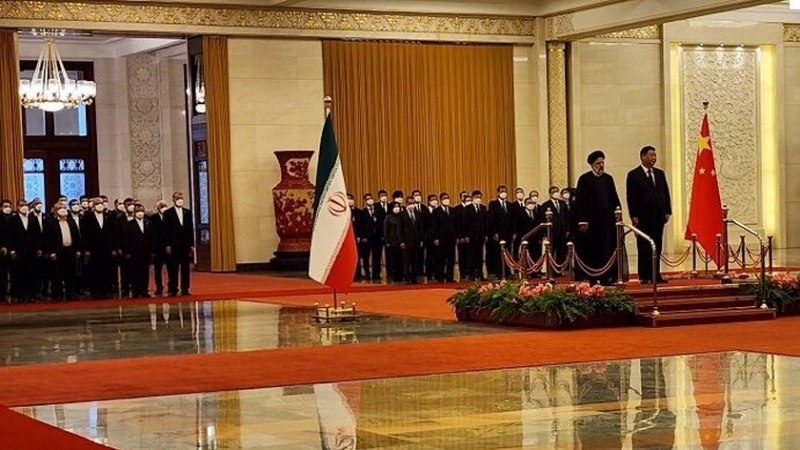 Iranpress: مراسم الاستقبال الرسمي للرئيس الايراني من قبل نظيره الصيني